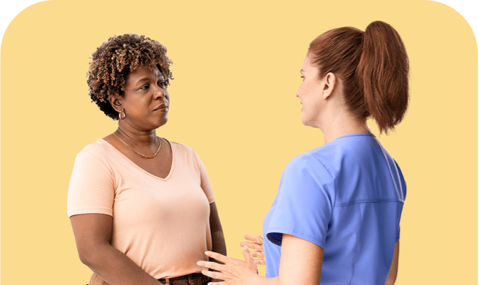 Patient having a discussion with their healthcare provider. Actor portrayals.